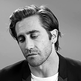 Jake Gyllenhaal speaking in black and white