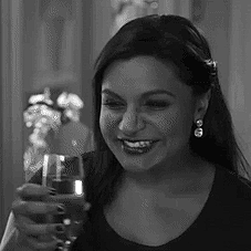 Mindy Kaling speaking in black and white